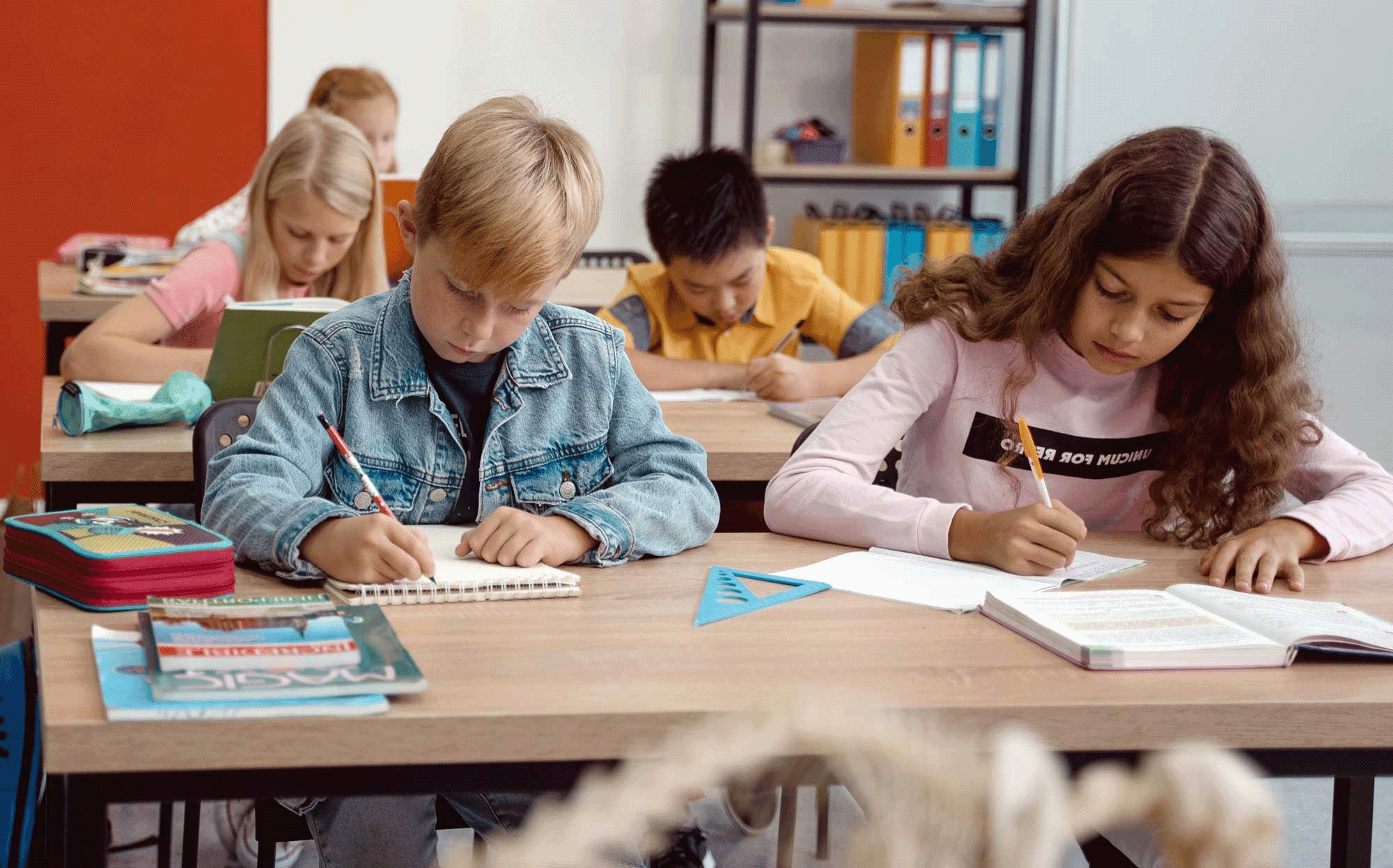 children focused on learning in tuition setting